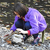 Girl stacking rocks