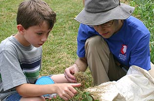 Student and instructor examine plants