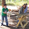 Students sawing wood